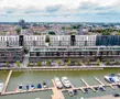 Een aangename wandelroute langs het water, omgeven door architectuur, in Quartier Bleu, Hasselt.